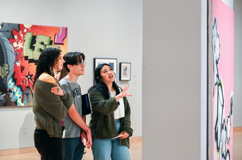 Art History students discuss work on the wall at the Hunter Museum of American Art