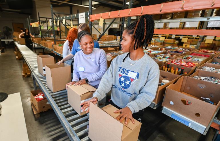 Students work to package food at Chattanooga Food Bank