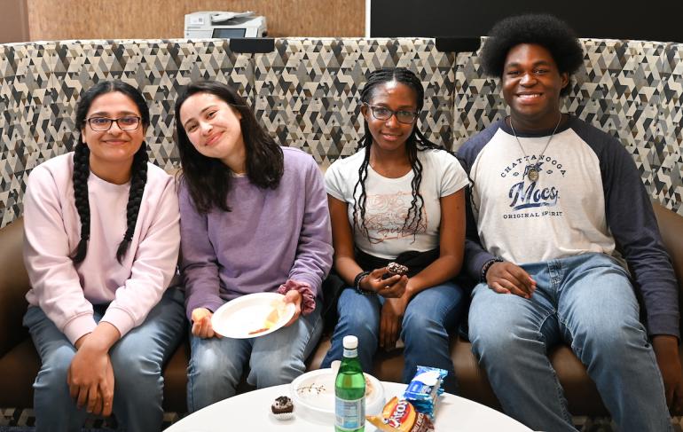 UTC students unwinding with snacks in a UTC lounge
