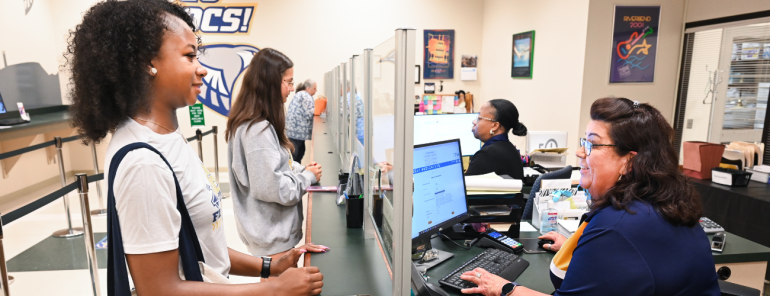 Student is assisted by a staff member in the Bursar's Office. 