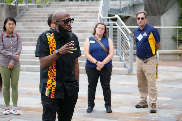 faculty talking by Walnut Street Bridge