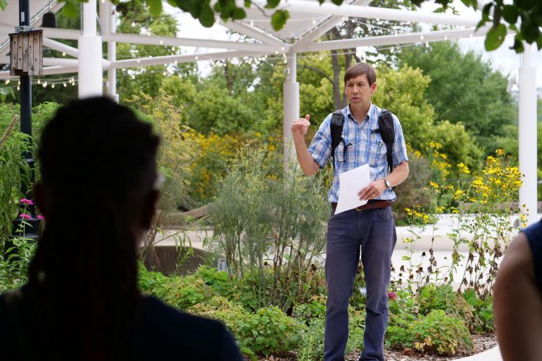 faculty talking near Aquarium