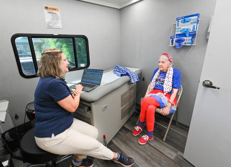 Patient getting seen inside the mobile clinic