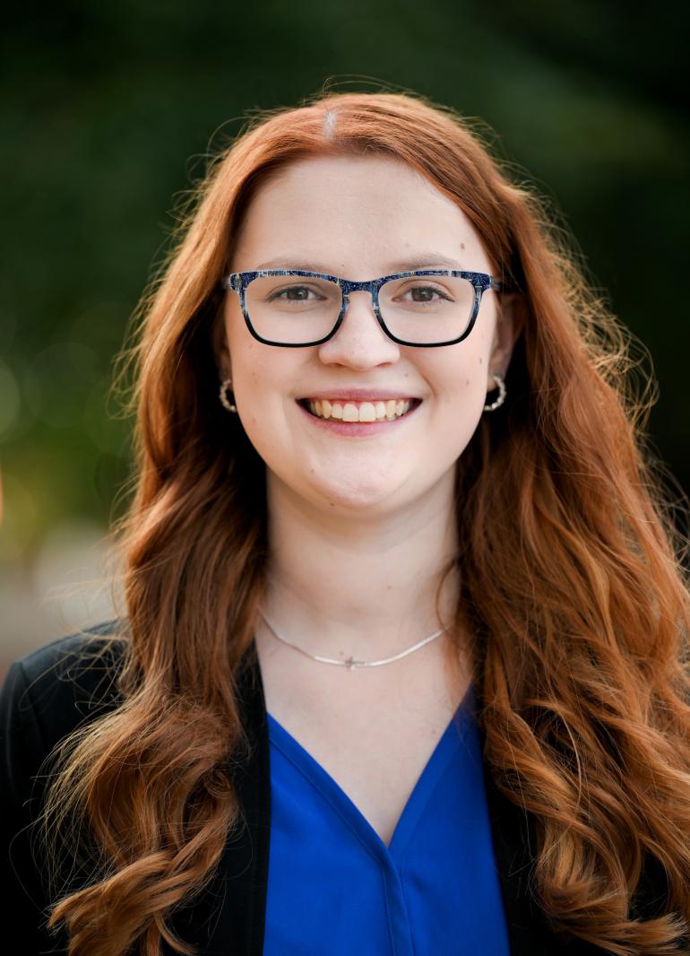 Professional headshot of Madison