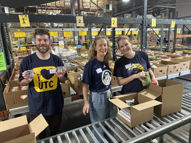 Image of people volunteering in a food bank.