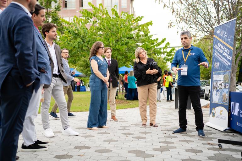 UTC Chancelor and others listening as Gazi Akgun (UTC) speaks during a demo at Chattanooga Connect 2025