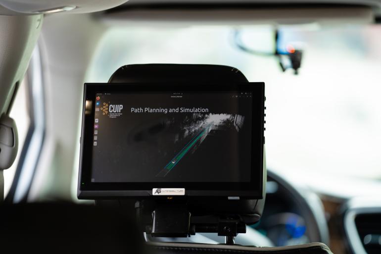 A small screen showing the trajectory path from the back seat of an autonomous vehicle.