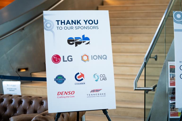 A sign showing conference sponsors