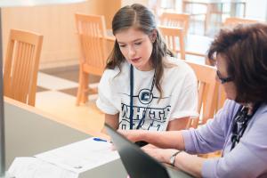 Student getting help on homework in UTC Library