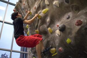 JFOU student tries his skils as a rock climber. JFOU student tries his skils as a rock climber.