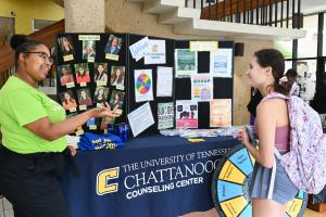 UTC Counseling Center UTC students in front of a counseling center table
