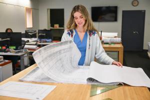 UTC architect student intern UTC architect student intern looking at blueprints