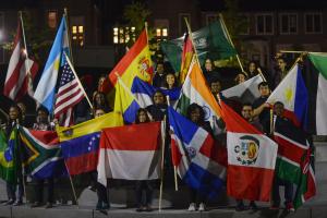 UTC international students holding flags