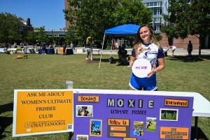 UTC Student Organization Fair Female UTC students in front of a Moxie frisbee table