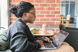 UTC student working on a laptop