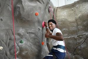 UTC transfer pathways UTC orientation leader climbing a rock wall