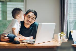 Man working at home with his son, making his schedule work for his lifestyle