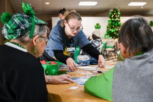 Occupational Therapy student with older adults in the Bradley-Cleveland Senior Center