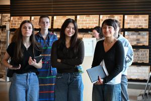 UTC students holding notebooks and learning leadership skills