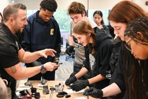 UTC criminal justice students learning how to dust for fingerprints 
