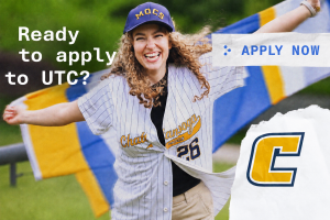 Woman in baseball jersey with UTC flag