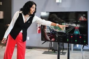 Dr. Mina Sartipi points to graphs on a screen