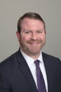 Professional headshot of Brendan Hawkes