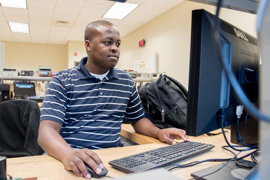 Types of jobs computer scientists can do A photo of a computer science student sitting at a computer working.