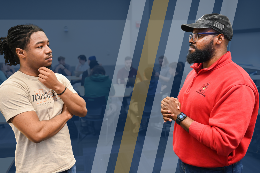An RCOB student speaks with an instructor during a management class.