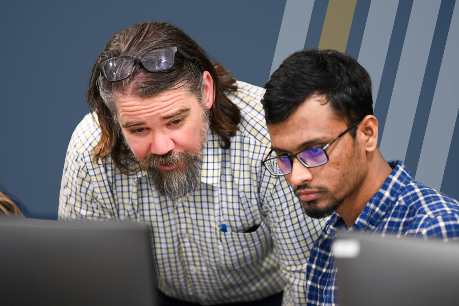 UTC professor Steve Davenport works with an accounting student