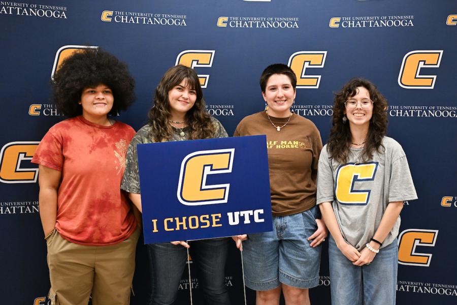 UTC Students holding an "I Choose UTC" sign