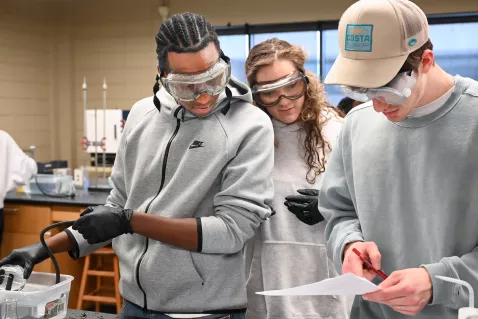 Three UTC students in a chemistry class