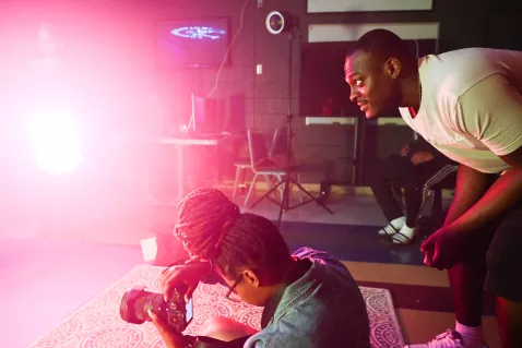UTC communication students taking photographs on a set