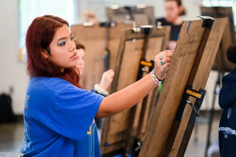 UTC Art Student drawing at an easel 