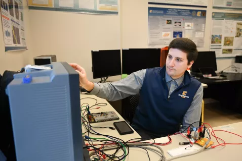 UTC computer engineering student working on some equipment