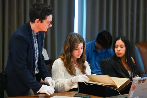 UTC History students examining old texts