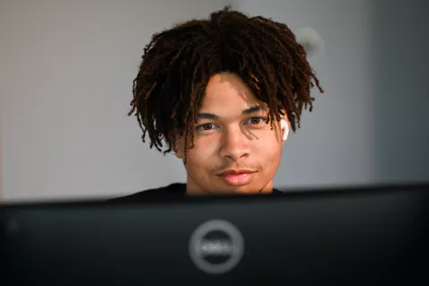 UTC Leadership student looking at a computer
